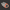 Gray and orange plastic connector on a white background