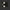 Black electronic component with labeled pins on a black background
