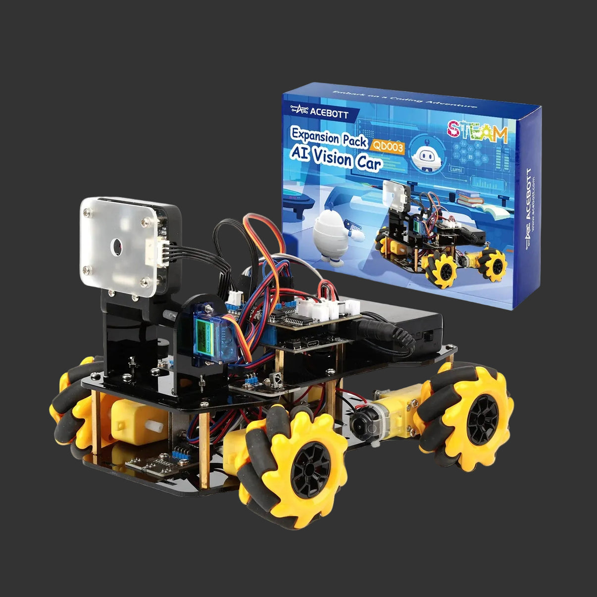 Robotic vehicle with yellow wheels and black components next to its packaging on a white background