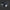 Black robotic device with wheels and sensors on a black background