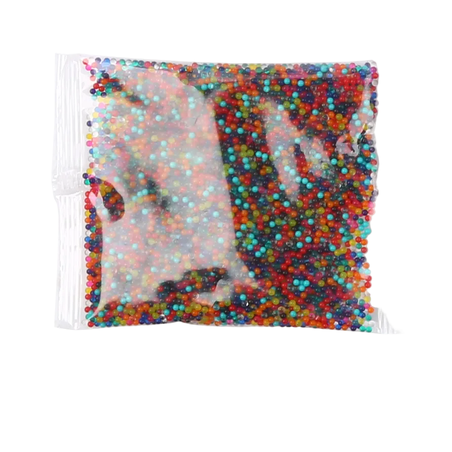 Bag of multicolored small beads on a white background