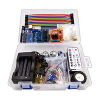 Electronics components in a clear plastic box on a white background